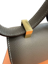 Close-up of the strap attachment on the Hermès Constance 24 Brown Epsom Leather Crossbody Shoulder Bag.