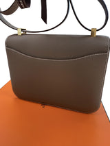 Strap and gold-tone hardware detail on the Hermès Constance 24 Brown Epsom Leather Crossbody Shoulder Bag.