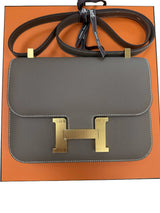 Front view of the Hermès Constance 24 Brown Epsom Leather Crossbody Shoulder Bag with gold H clasp.