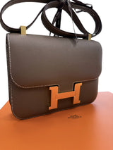 Angled front view of the Hermès Constance 24 Brown Epsom Leather Crossbody Shoulder Bag.