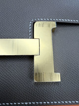 Gold H closure detail on the Hermès Constance 24 Brown Epsom Leather Crossbody Shoulder Bag.
