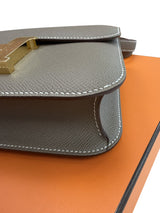 Side construction of the Hermès Constance 24 Brown Epsom Leather Crossbody Shoulder Bag.