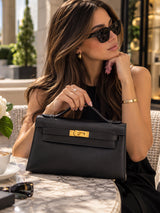 Hermès Kelly Pochette Noir Swift Leather With Gold Hardware Clutch Bag