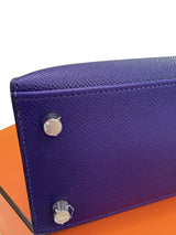 Close-up of the bottom corner of Hermès Kelly Sellier 25 Purple Epsom Leather Palladium Hardware 2026 Handbag