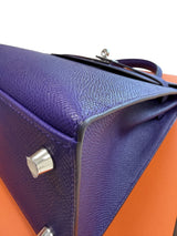 Close-up of the bottom corner of Hermès Kelly Sellier 25 Purple Epsom Leather Palladium Hardware 2026 Handbag